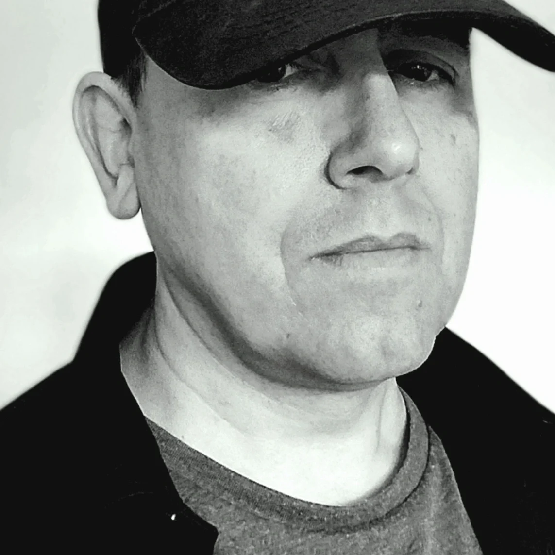 John Raven, author of urban fantasy, post-apocalyptic and zombie stories. John Raven looking longingly at photo of beautiful woman while drinking whisky.